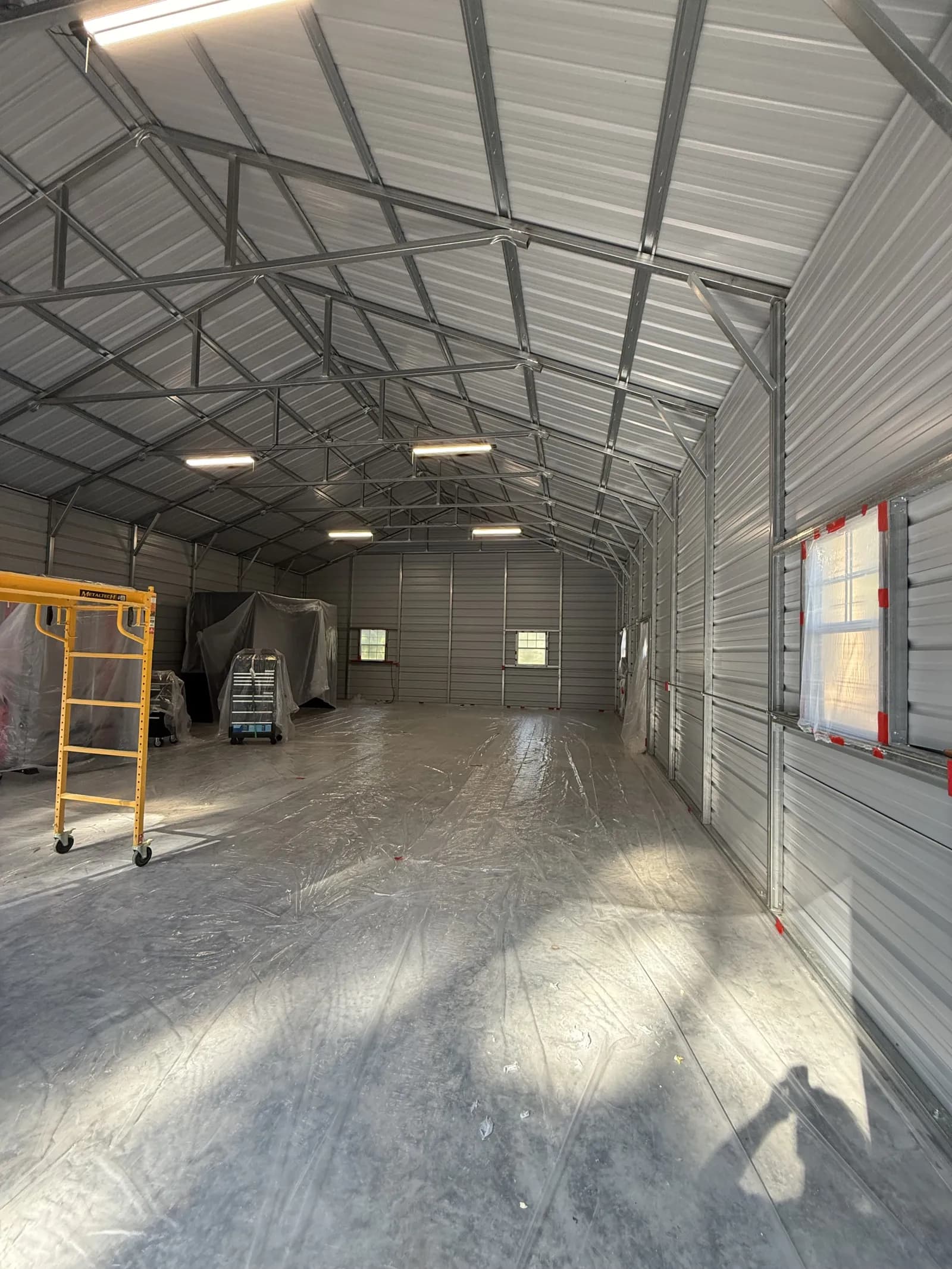 Bare metal building interior before spray foam insulation